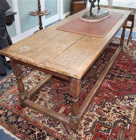 A 17th century style oak refectory table L.229cm